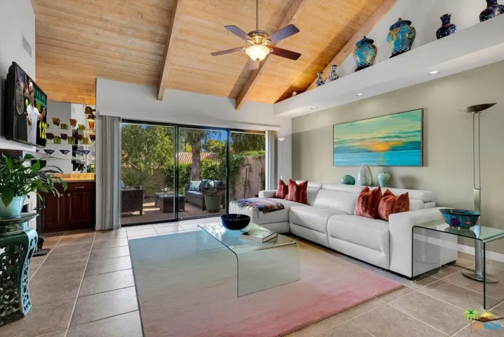 Large greatroom with wood planked & vaulted ceilings.