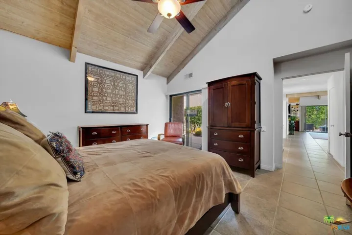 Vaulted ceilings & view into courtyard.
