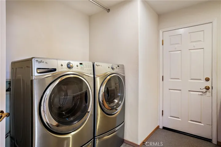 Laundry room with sink and lots of storage