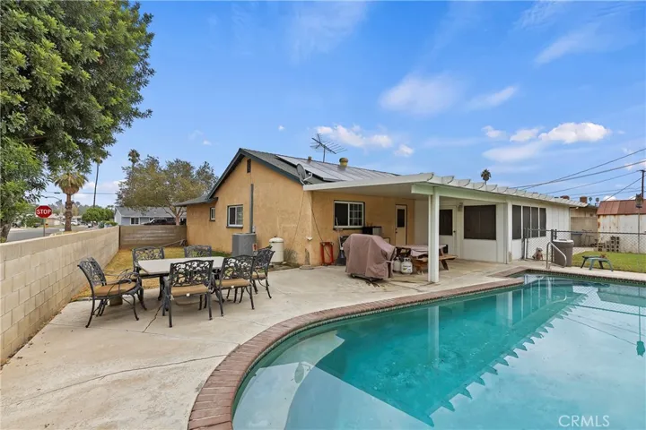 Side yard, pool & covered patio