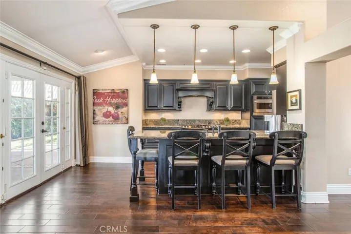 Kitchen dining area and island from familyroom