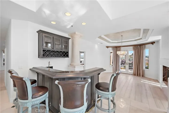 Wet Bar With Wine Refrigerator In Formal Living Area