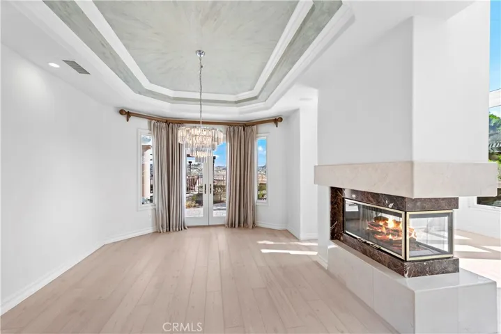 Formal Dining Room With Double Doors to Backyard Patio