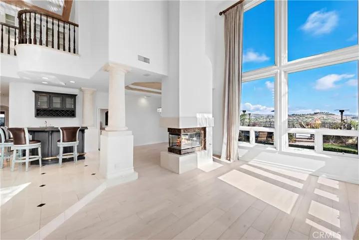 Formal Living & Dining With 3-Sided Fireplace