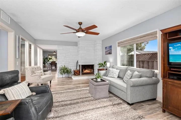 Standing at back slider looking to front of house, living room, foyer, then dining room.