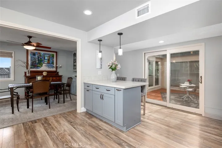 The dining room opens to this gorgeous kitchen! Completely remodeled and upgraded, the kitchen also looks to the outdoor atrium. Open the slider to bring in the breeze.