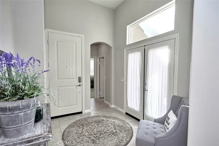 Abundant Natural Light from the doors leading to the private foyer patio!