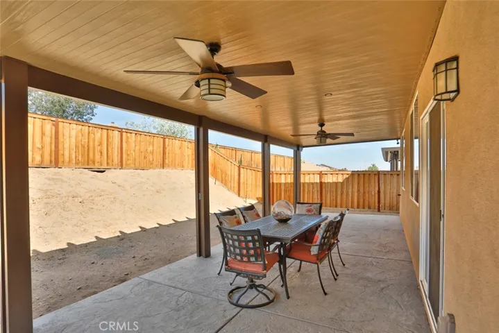 Patio with finished ceiling, recessed lighting, ceiling fans, stamped & stained concrete
