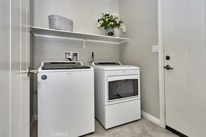 Indoor laundry room off the kitchen.  All interior doors are the lovely paneled farmhouse doors,