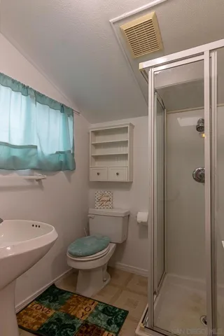 2nd bath off the 3rd bedroom. This is the one that can be closed off and turned into a private studio.  All bathrooms have showers only.