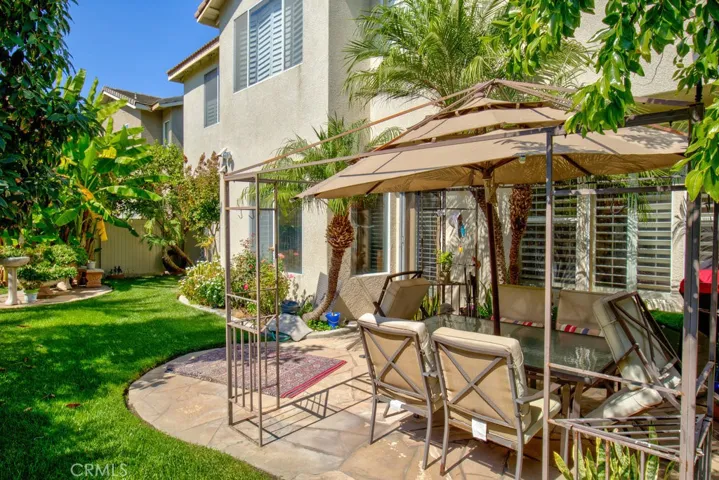 Beautifully landscaped patio with seating area