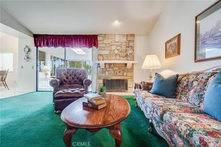 Back into the house; here is the family room with a fireplace.