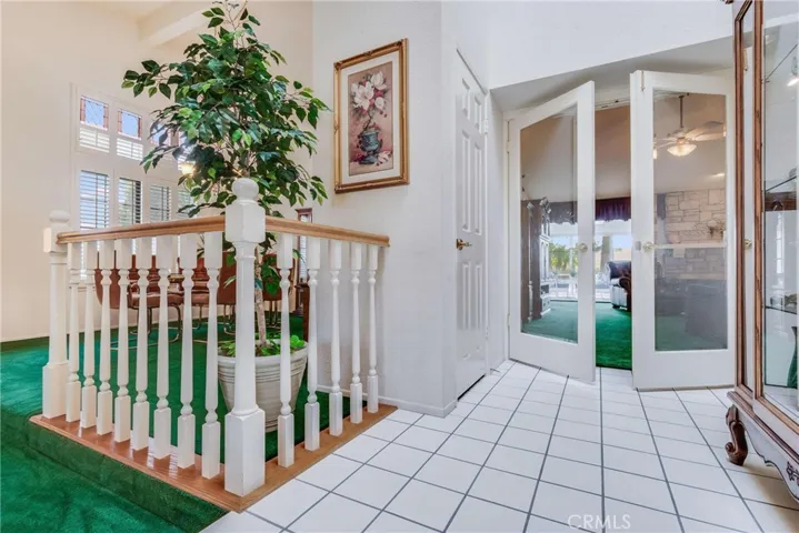 This is the entry, into the home. There is a step-down living room. Notice the glass doors into the family room.