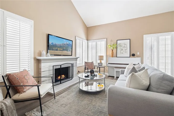 Living room centered around a cozy fireplace