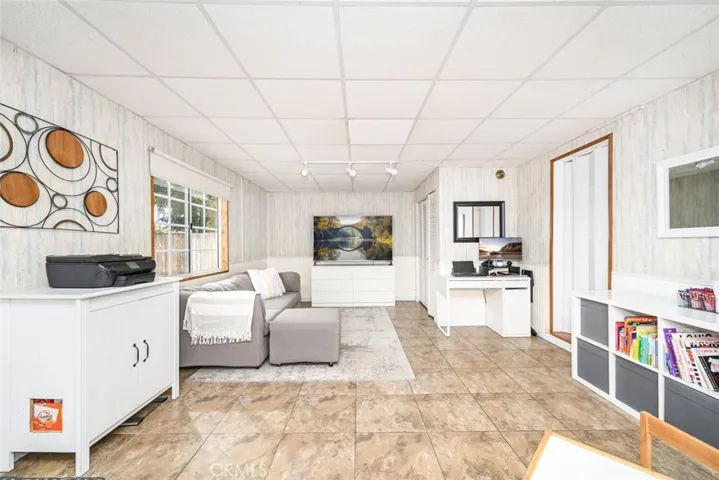 Enclosed Patio Being Used as Play/TV Room