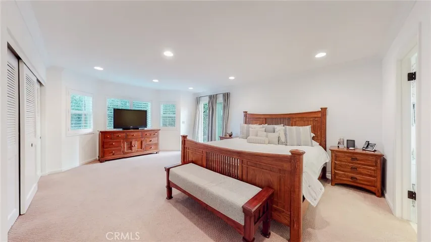 Spacious, sunny primary bedroom.