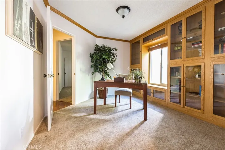The office can be accessed from the hall and the family room.