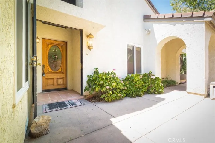 Alternate view of the private courtyard entry and beautiful front door.