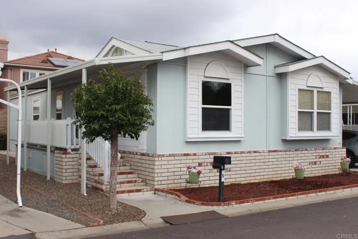 Front view showing attractive exterior of home and front porch area.