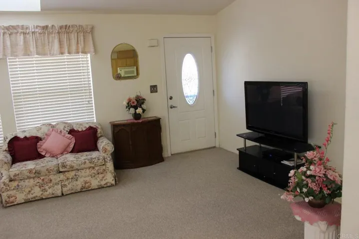 View of living room to beautiful front entrance door