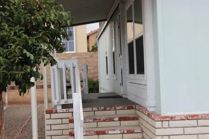 View of front of home showing covered porch.