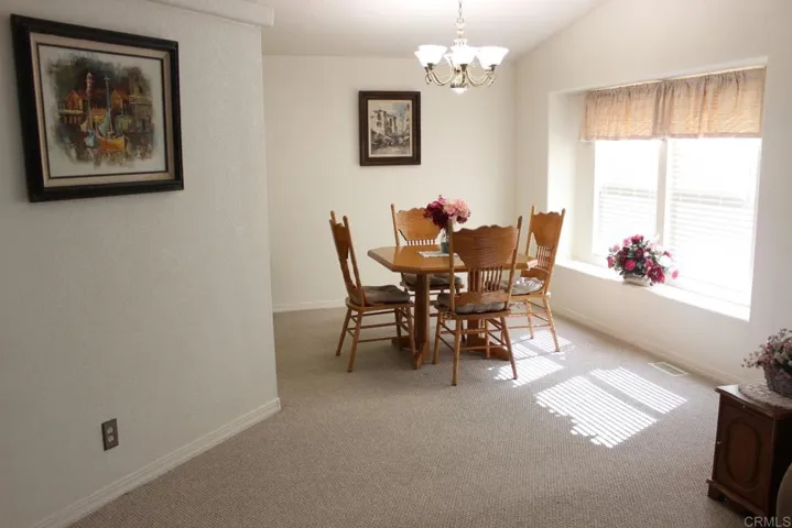 View of dining room off living room and kitchen