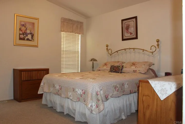 View of large master bedroom with vaulted ceilings