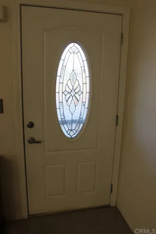 View of front door with beautiful glass window