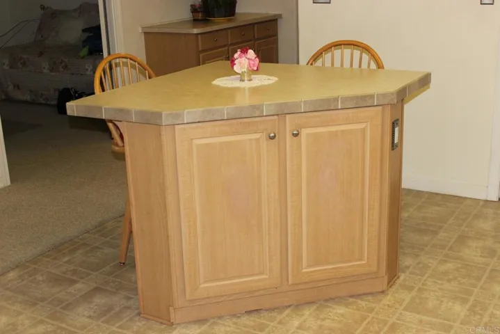 View of free standing island in kitchen.