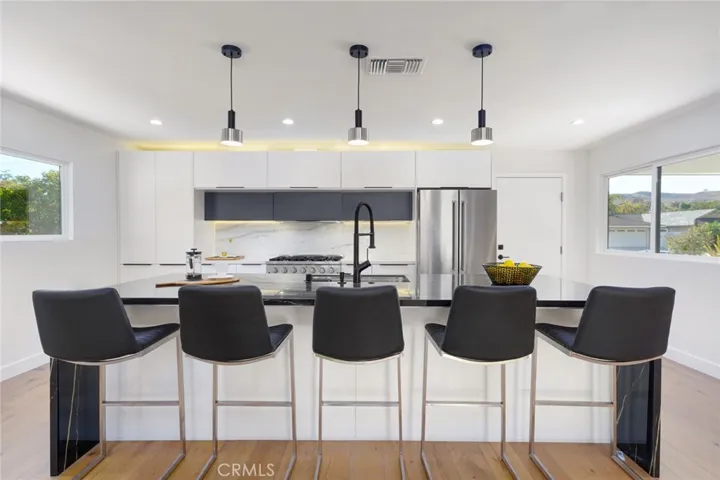 Counter top seating for 5 at Oversized Waterfall Island