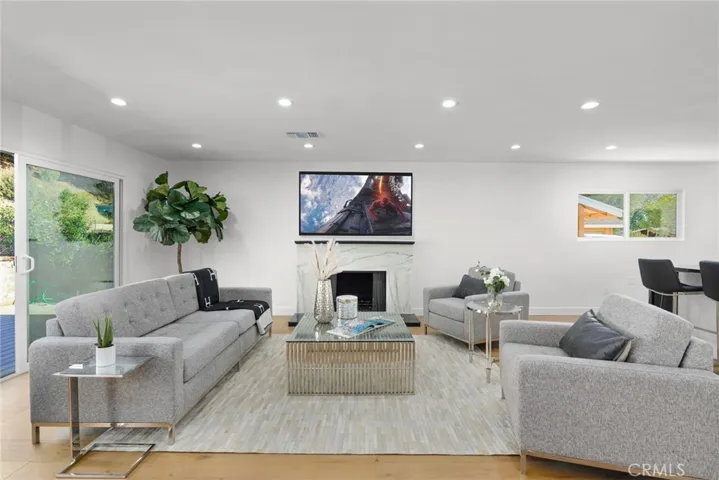 Crisp Fireplace in Lounge area steps from Pool