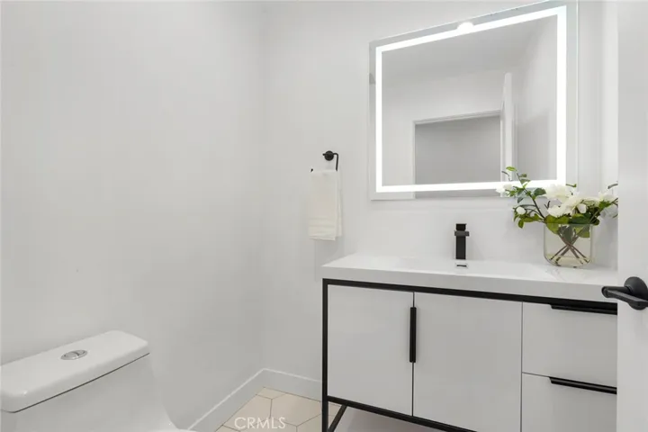 Powder room w/LED lighting & low profiled vanity