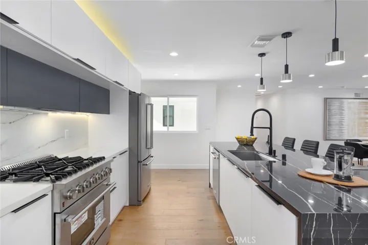 Sleek Matte White cabinetry w/6 burner Range & hood