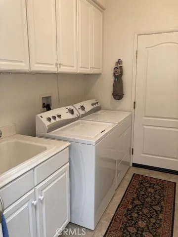 Laundry room with sink.