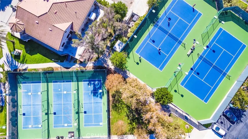 Lighted tennis and pickle ball/paddle tennis courts at the clubhouse.