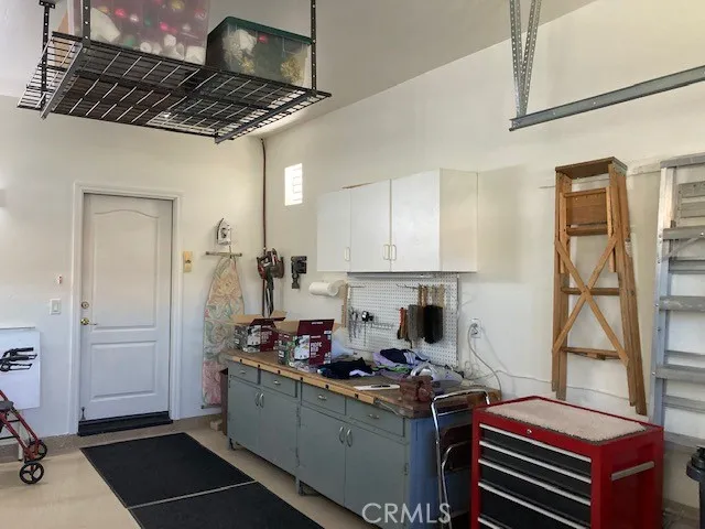Garage has lots of built in storage and a finished floor.