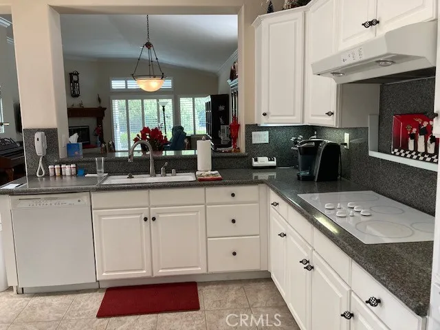 Kitchen has quartz countertops.