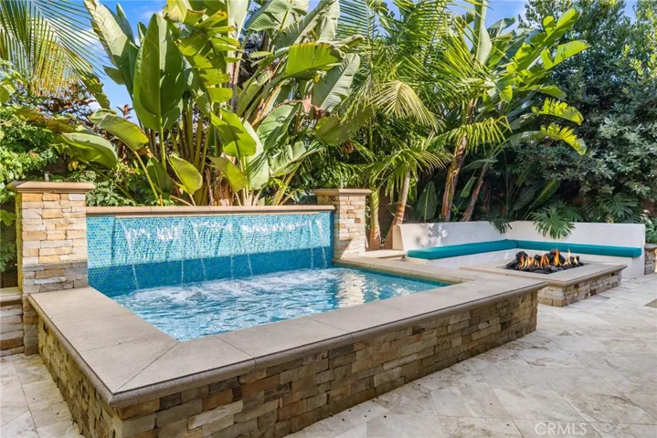 Huge custom spa and fire pit with seating for all your guests.