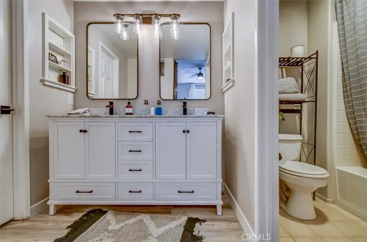 Another Photo of the Vanity and adjoining Toilet and Shower Area.