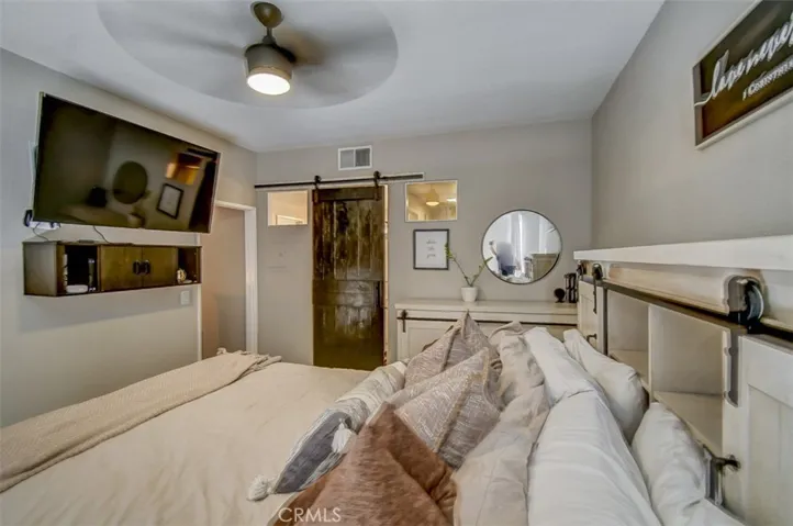 Looking toward Walk In Closet, Vanity and Bathroom w/Tub and Shower