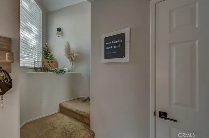 Upstairs Entry from Front Door and Easy Access Garage with Full Laundry Hookups