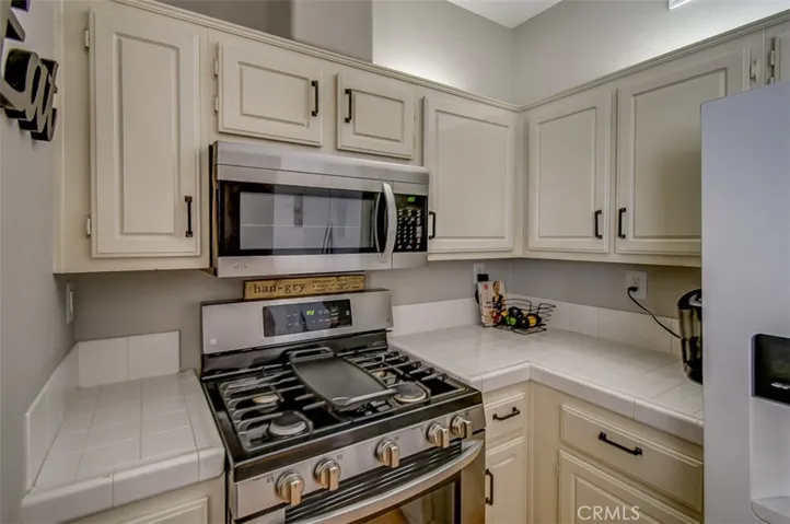 Beautiul Colors throughout the House notice the uplighting in the Kitchen also Pendent Lighting over the Sink