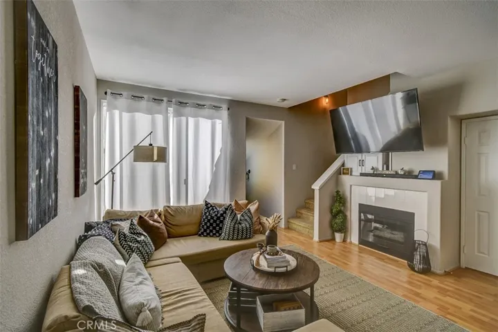 Comfortable and Spacious Living Area with Patio, Stairway Fireplace and Convenient 1/2 Bath, Flooring and Colors throughout the house all transition to tranquility!