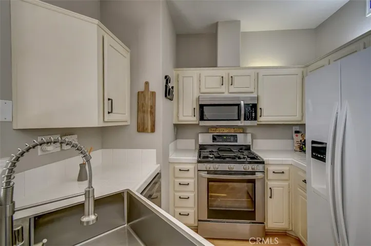 Very Nice Updated Kitchen, Stainless Streel Stove and Microwave and New Farmhouse Style Sink and Faucet