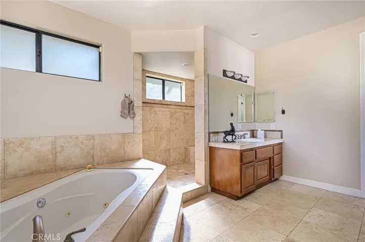 large sunken tub and double walk-in shower