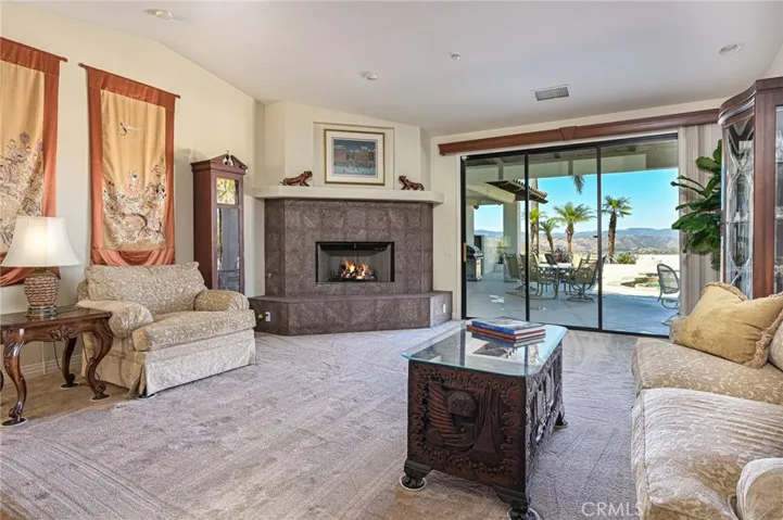 Living Room with a fireplace and views ....