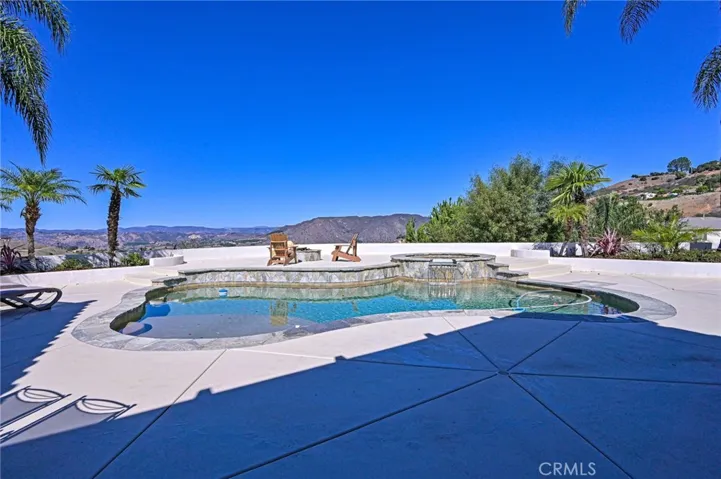 Spacious deck surrounds the pool