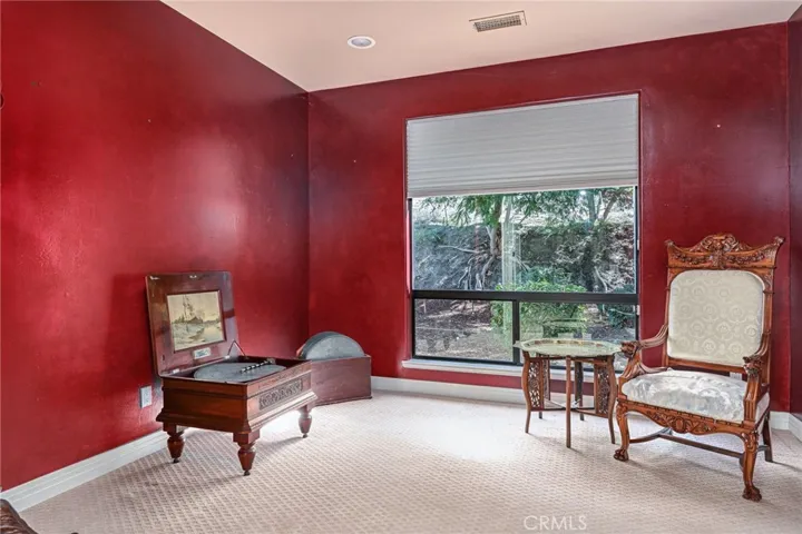 Room off the primary bedroom... private office, exercise, wine or music room...endless options
