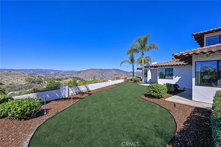 Side yard with grass and views
