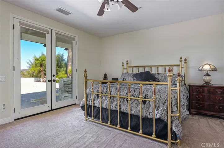 Primary bedroom with sunset and mountain views